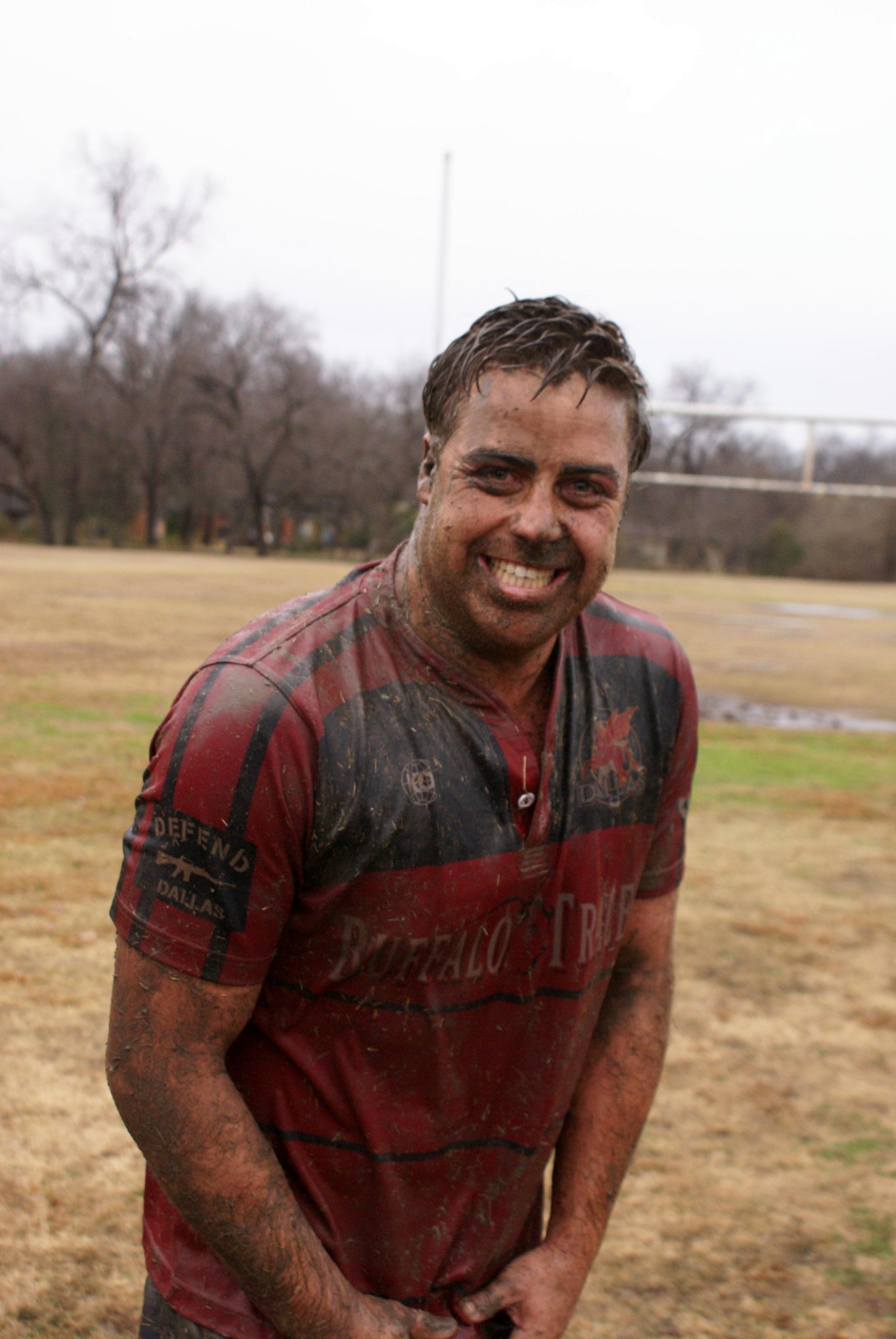 Jeremy Nielson smiles after a muddy match.