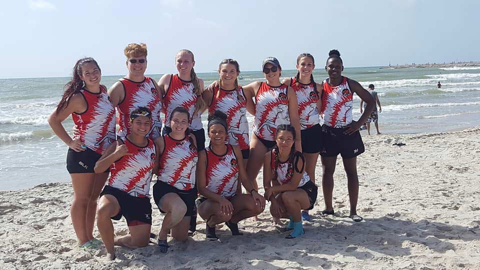 Dallas Rugby Women pose on the beach after 7s tournament